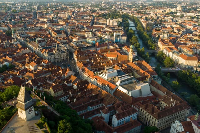 Aerial view of the Graz old town with the clock tower on the Schlossberg