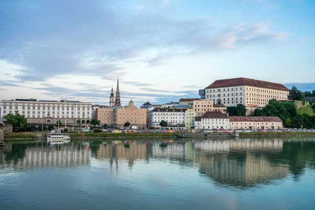 Linz waterfront and castle reflected in the Danube