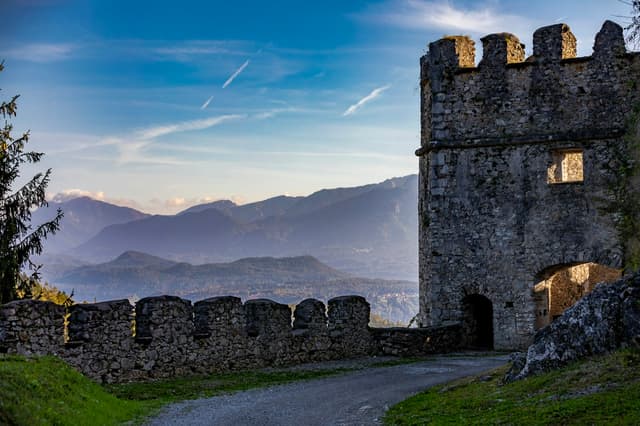Medieval castle walls near Villach with mountains behind